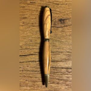 Beautiful Hand turned wood pen with black ink. Smooth writing. Antique Brass.